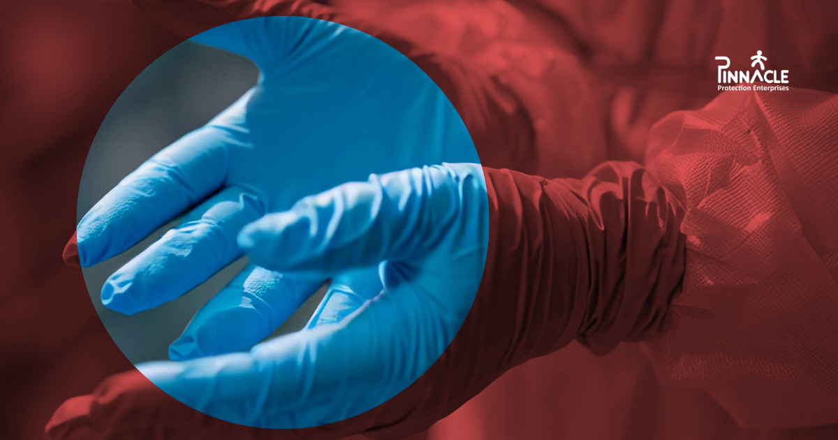 Healthcare worker wearing blue nitrile disposable gloves and protective clothing, with the guide title Choosing the Right Disposable Glove